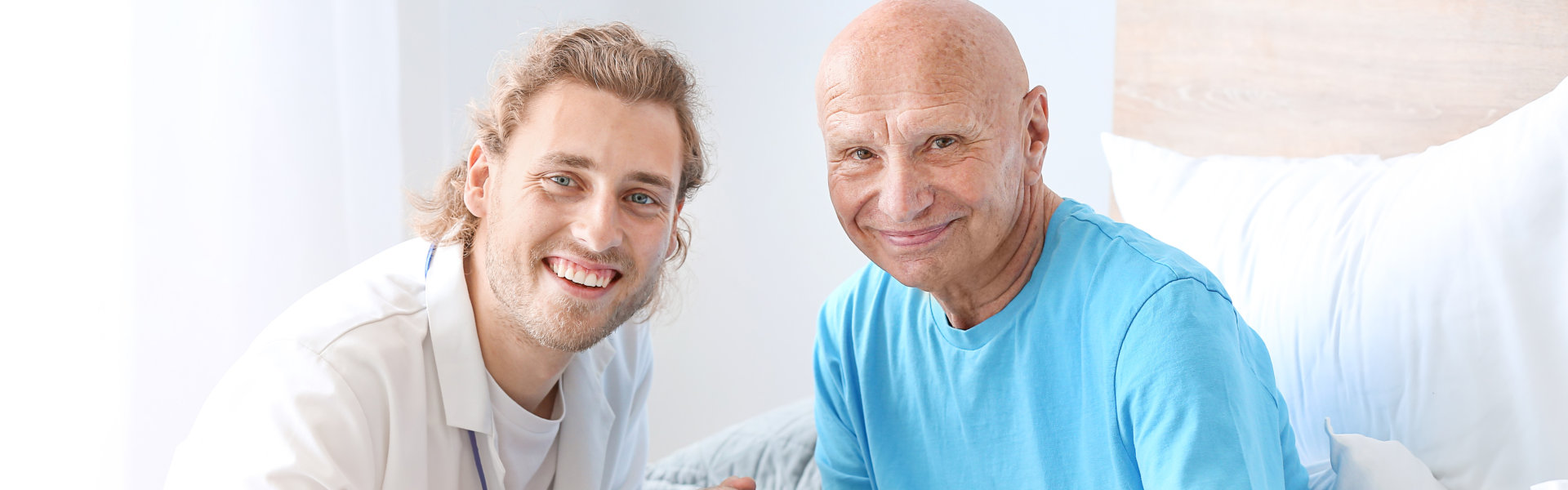 caregiver and his patient smiling