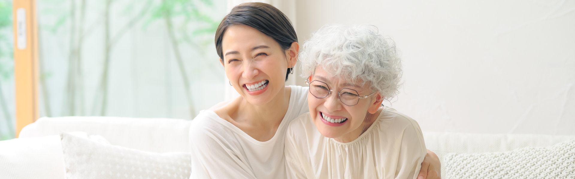 caregiver and her patient sit on the sofa